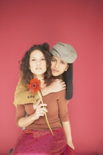 Two women hugging each other