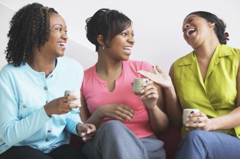 Three women together laughing