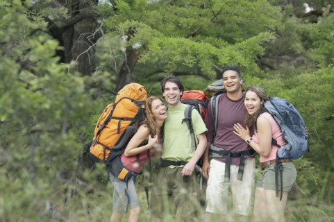 Portrait of two young couples hiking in a forest