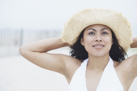 Young woman wearing a straw hat