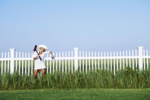 Hispanic woman holding croquet mallet