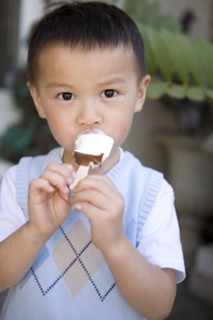 Chinese boy eating ice cream
