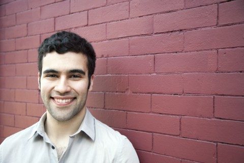 Hispanic man smiling outdoors