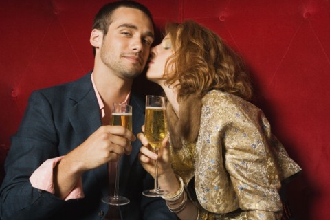 Woman kissing boyfriend's cheek