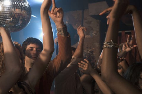 Multi-ethnic people dancing at nightclub
