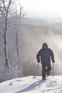 Caucasian man snowshoeing