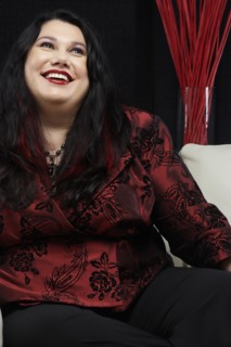 Caucasian woman smiling on sofa