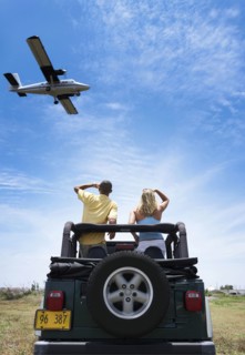 Couple admiring plane from 4x4