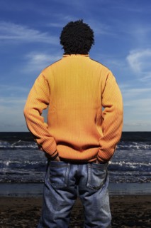 Black man standing on beach