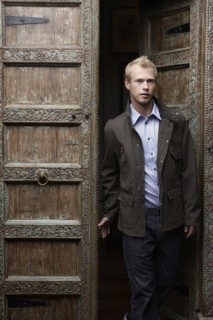 Caucasian man standing in ornate doorway