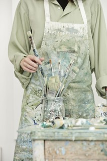 Caucasian painter working in studio
