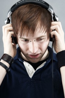 Caucasian man listening to headphones