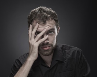Frustrated man with hand on face