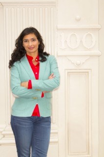 Mixed race woman smiling outside building