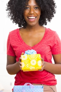 Mixed race woman holding birthday present