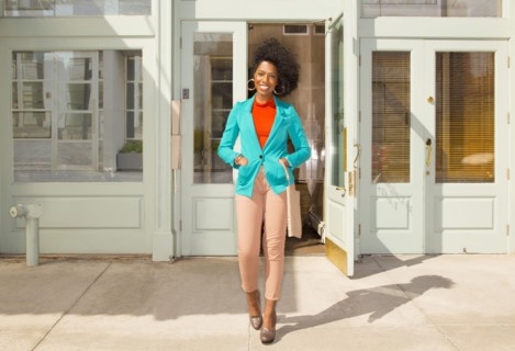 Mixed race woman standing on city sidewalk