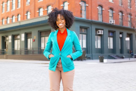 Mixed race woman standing on city street