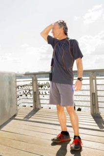 Caucasian man standing on wooden deck