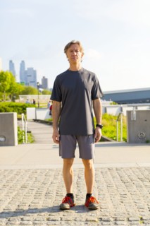 Caucasian runner standing in urban park