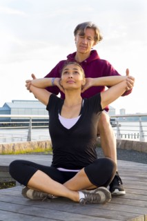 Couple exercising in waterfront park