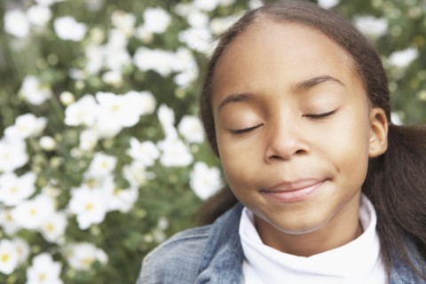 Mixed race girl with eyes closed