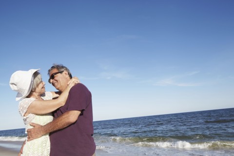 Senior couple dancing on tropical beach