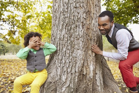 Father and son playing in park