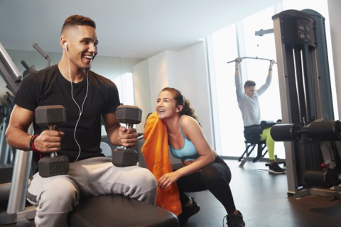 Friends working out in gym