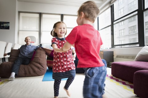 Children dancing in living room
