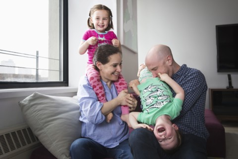 Family playing in living room