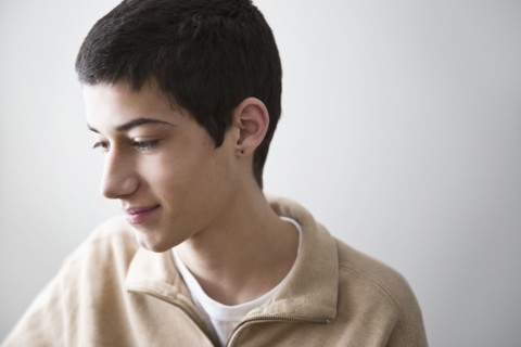 Mixed race teenage boy smiling