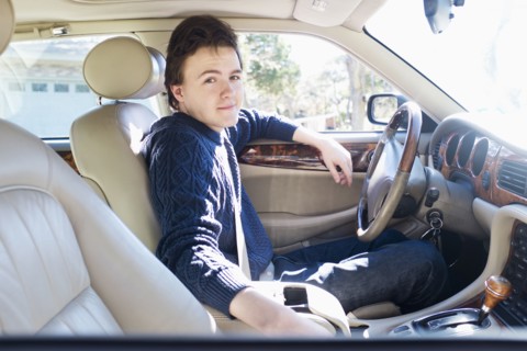 Caucasian man driving car