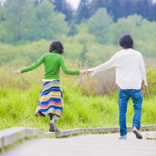Asian couple holding hands