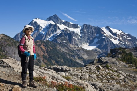Japanese woman hiking near mountain
