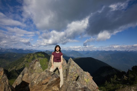 Japanese woman posing on mountain top