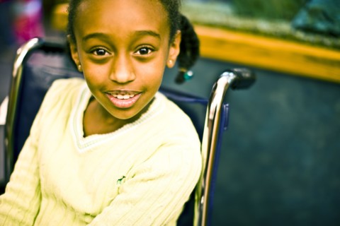 African American girl sitting in wheelchair
