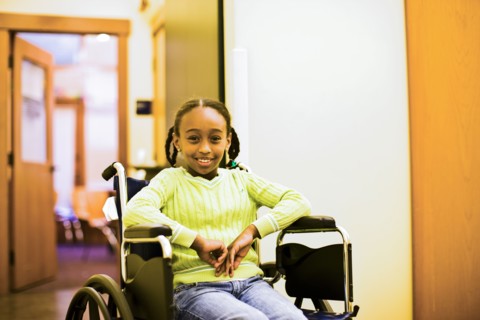 African American girl sitting in wheelchair