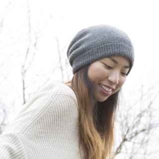 Japanese woman wearing beanie outdoors
