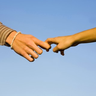 Japanese couple holding fingers