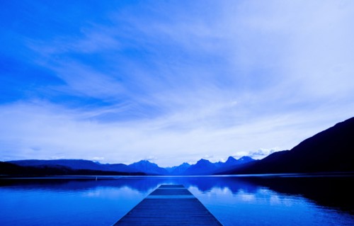 Wooden dock over still remote lake