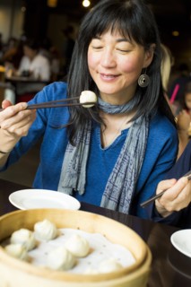 Japanese woman eating food with chopsticks