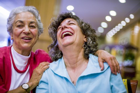 Caucasian women laughing