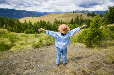Japanese woman enjoying scenic view of landscape