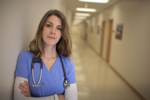 Caucasian nurse wearing stethoscope in hospital