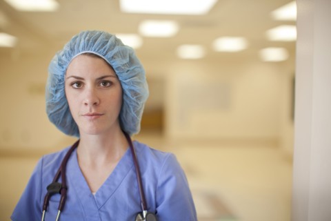 Caucasian nurse wearing hair net in hospital