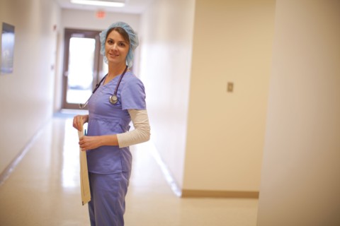 Caucasian nurse wearing hair net in hospital