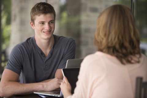 Caucasian students studying at table