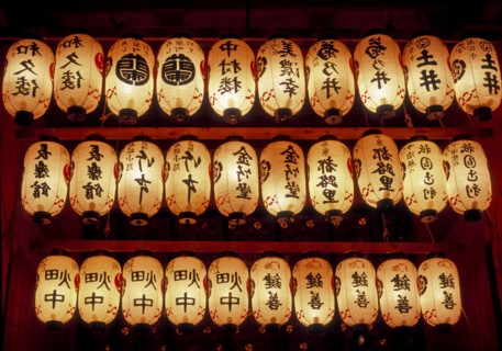 Rows of illuminated prayer lanterns at night
