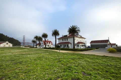 Houses and grass field near Golden Gate Bridge