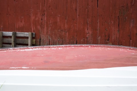 Rowboat stored upside-down at shack